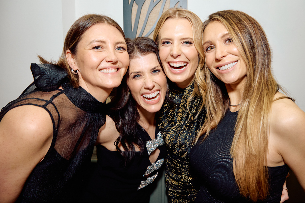 4 ladies hugging and having fun at a birthday party in London