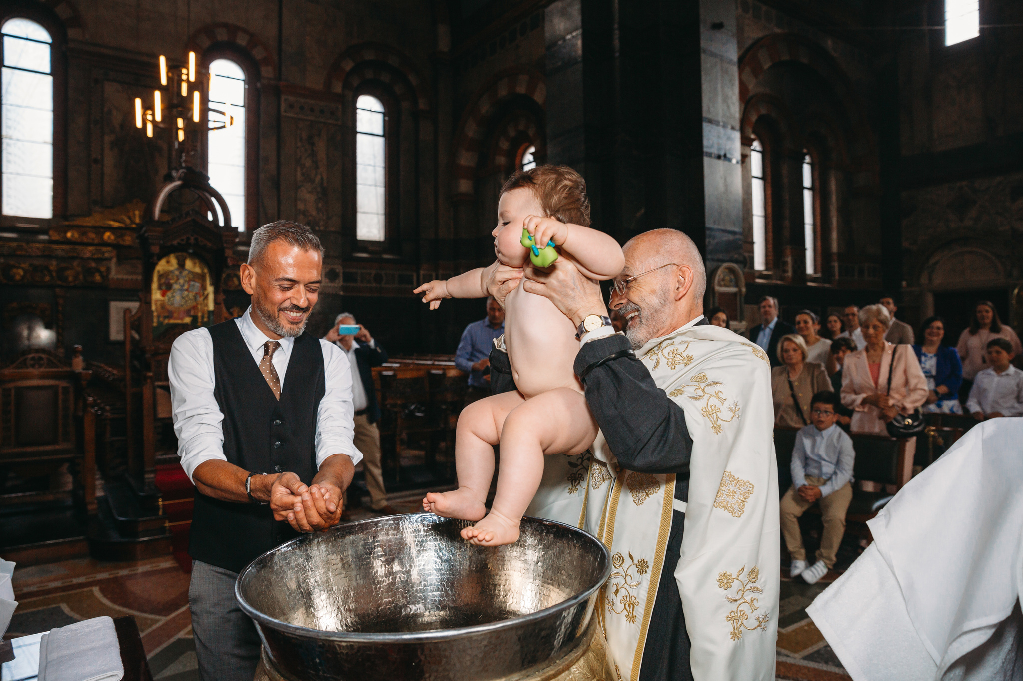 Baby being christened in church.