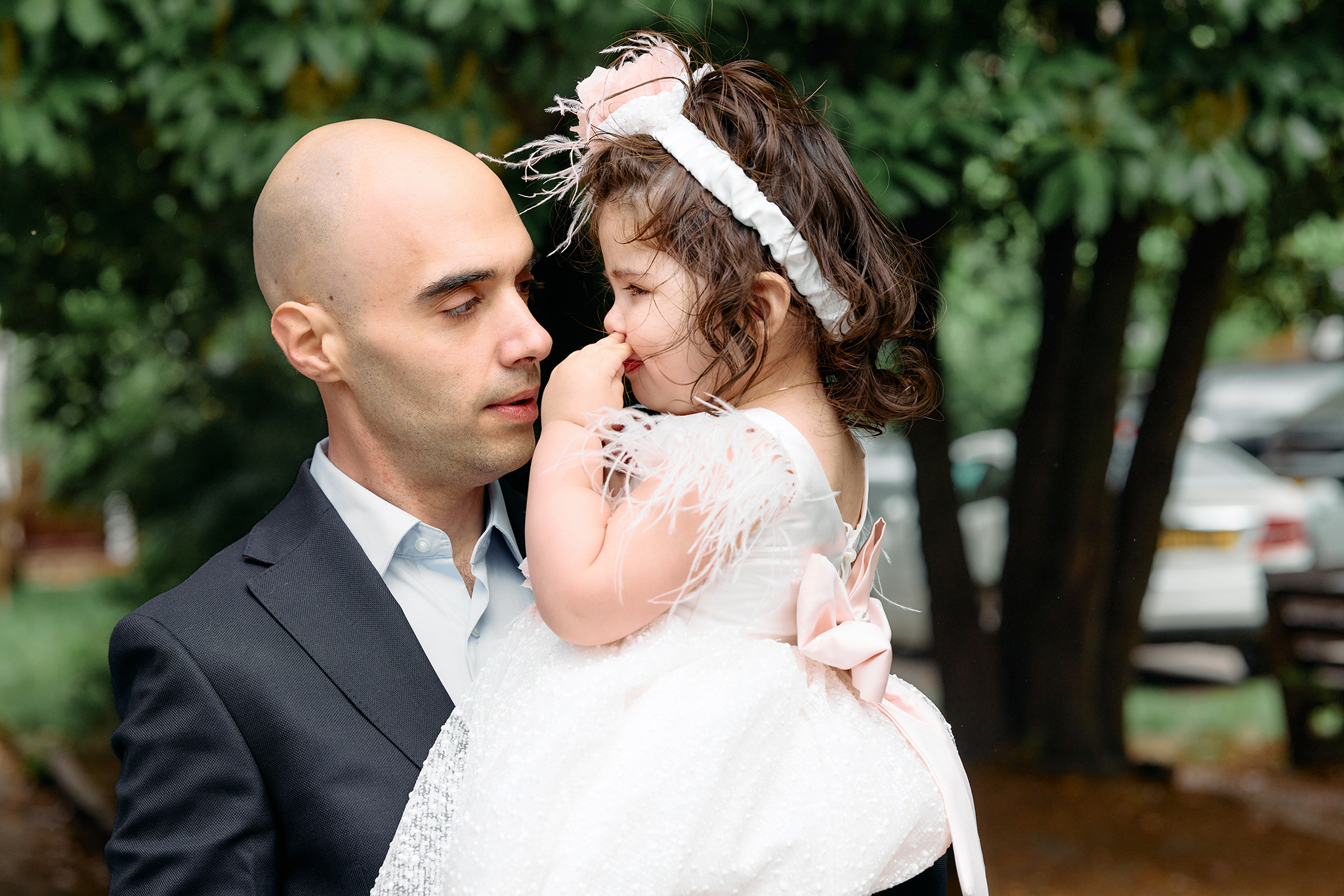 Dad with his little girl after she's been christened.