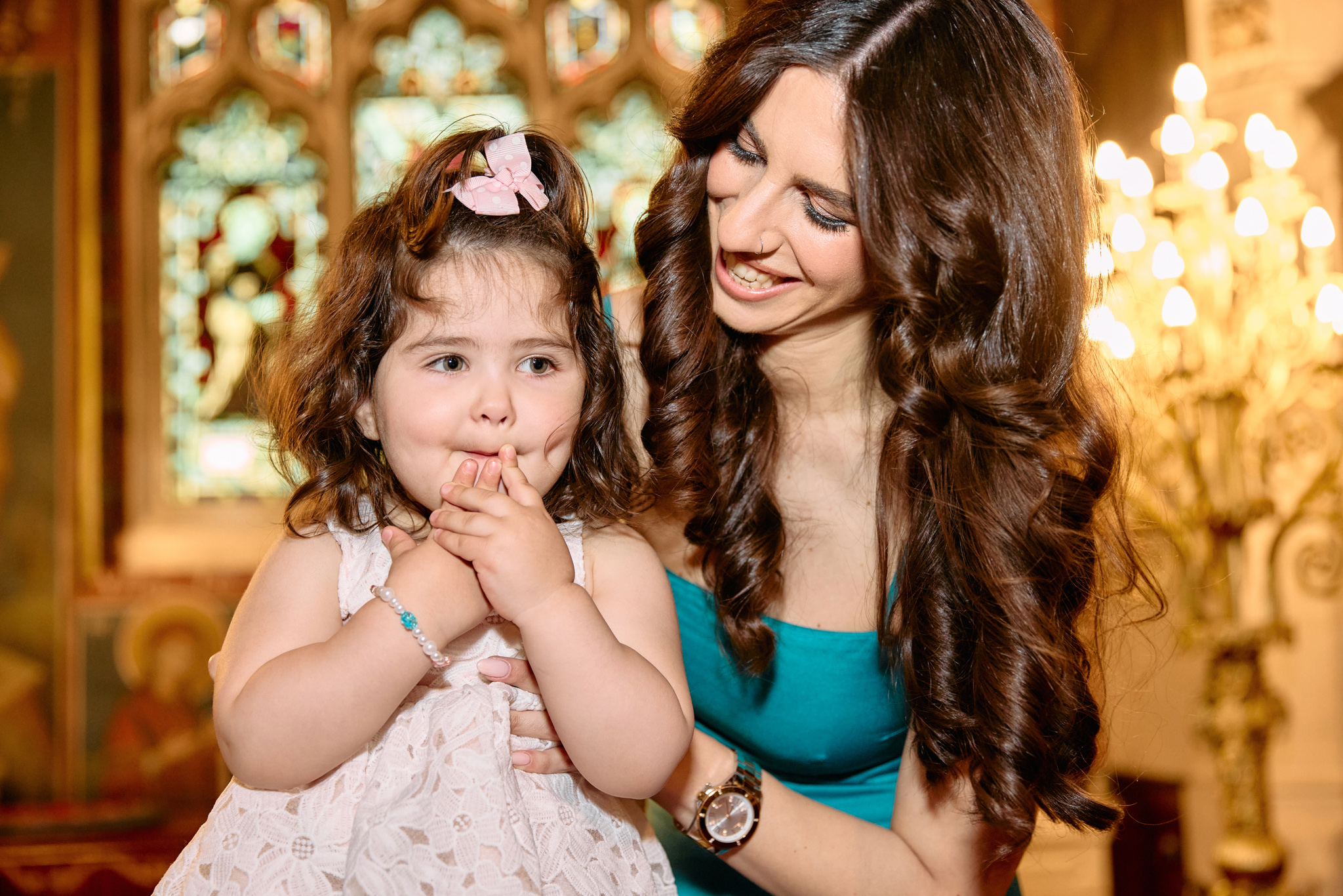 Little girls held by her godmother.