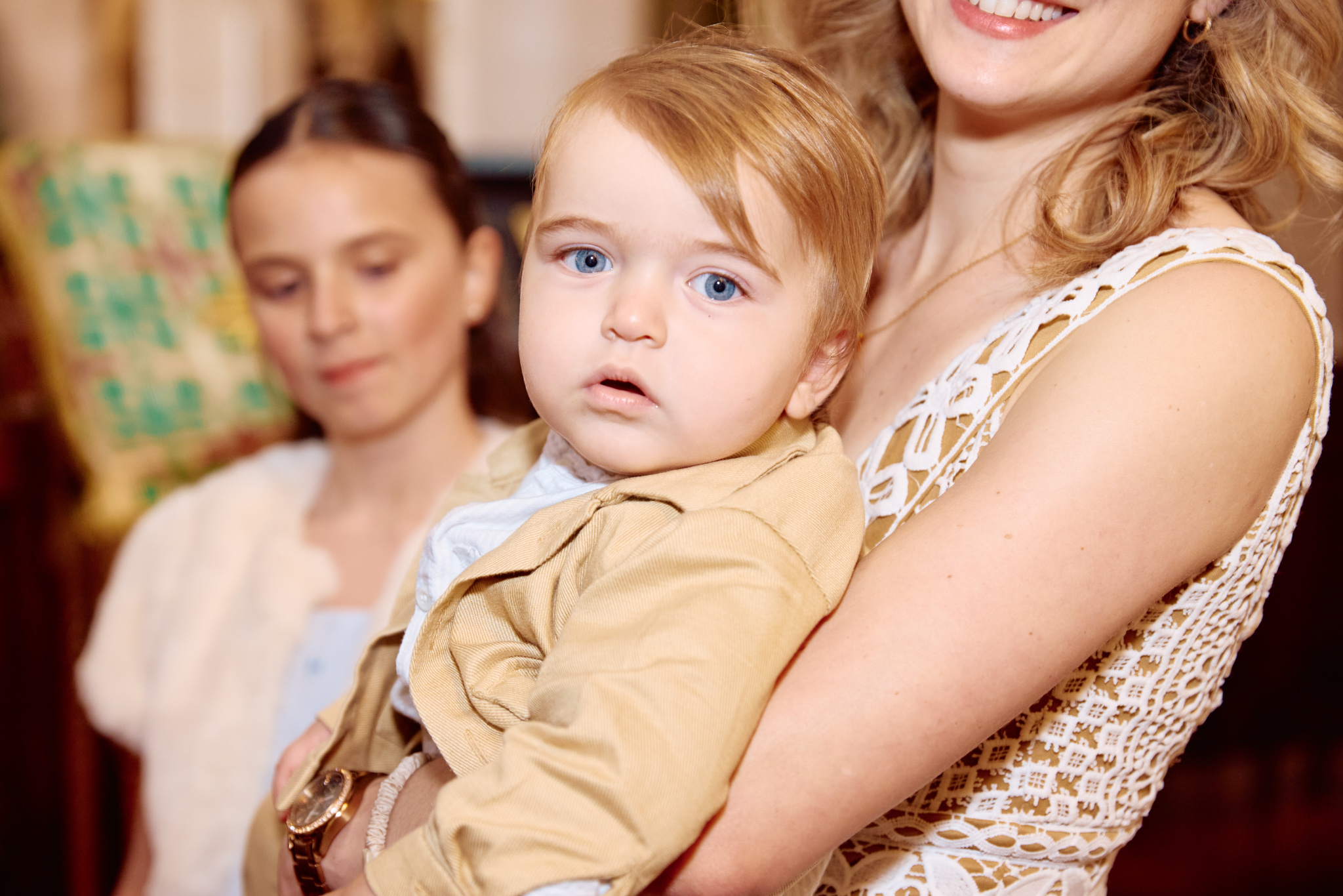 Little blond boy looking at the camera.