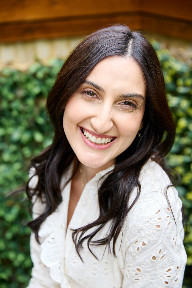 A lady smiling at the camera.